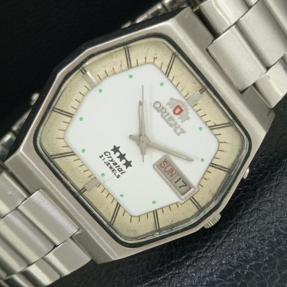 Vintage 1972 Orient Automatic Mens Silver Watch W/daydate & White accents